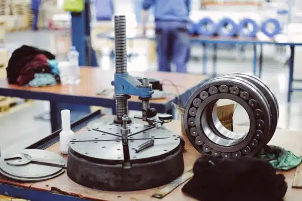 Steel flange on a work table undergoing visual inspection to avoid mistakes ASME flange order during assembly