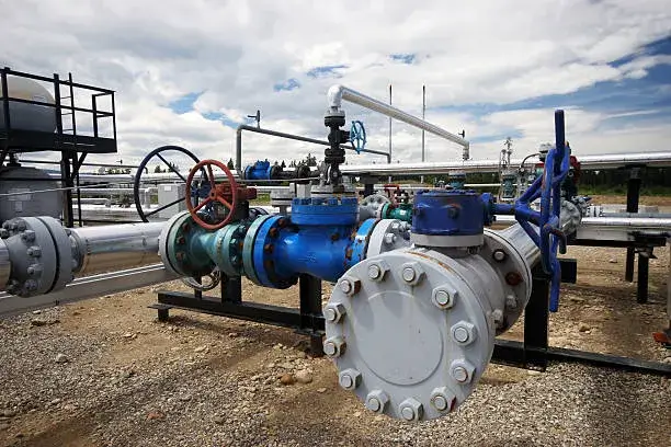 Large blind flange attached to industrial pipe used to demonstrate strength in Forged vs Cast Flanges