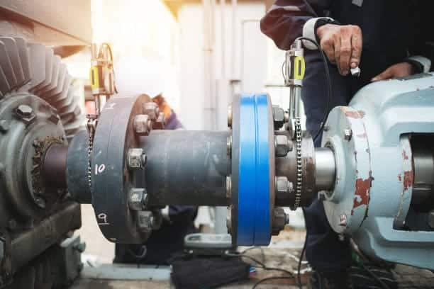 Technician checking flange mounted on a pipe to identify and prevent mistakes ASME flange order in the process